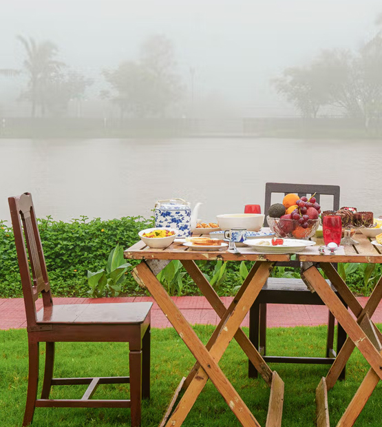 Lakeside breakfast setup at villas at Lonavala