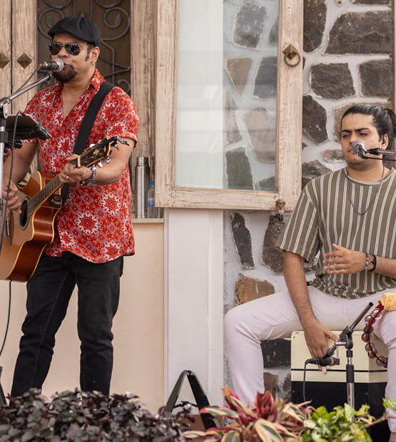 Live music performance during a family event at a scenic villa in Lonavala
